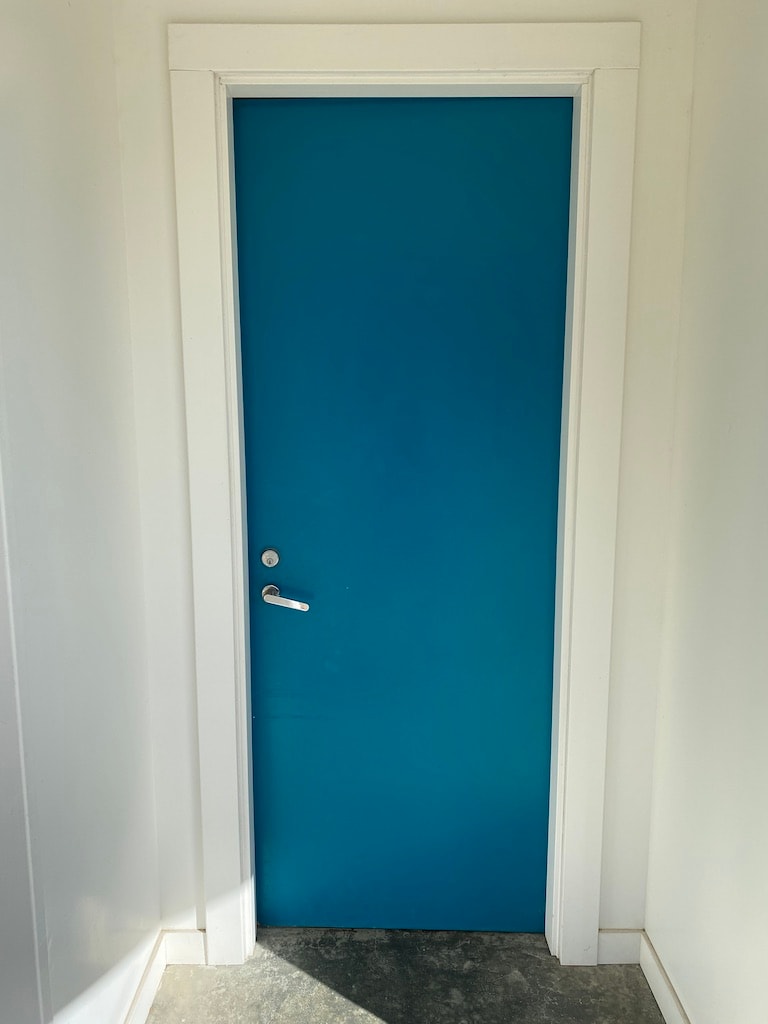 Teal Door on White Dove House